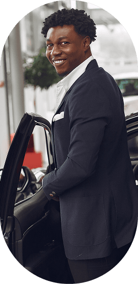 Man in suit opening car door
