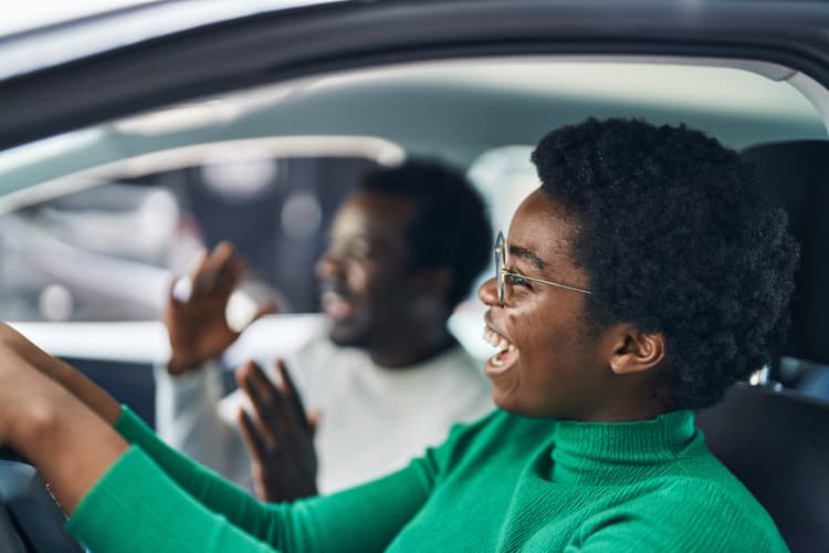 Happy friends in a car